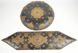 Indian ebonised hardwood shield with brass decoration, H84, together with a circular example