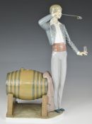Lladro 'Wine Taster' figure pouring a glass of wine from a barrel, H37cm