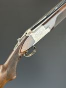 Browning B325 12 bore over and under ejector shotgun with engraved scenes of birds to the action,