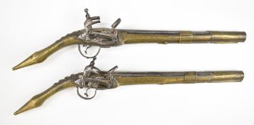 A pair of Albanian 20 bore Miquelet flintlock rat tail pistols, each with engraved brass body and