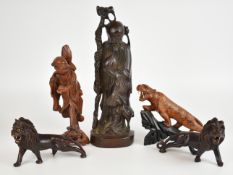 Chinese carved hardwood figures including a pair of lions with bone teeth, tallest 40cm