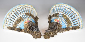Pair of reticulated porcelain wall brackets with figural ormolu / brass or similar figural