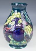 Moorcroft pedestal vase decorated in the Finches pattern, H19.5cm
