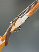 Miroku 12 bore over and under ejector shotgun with named and engraved underside, engraved action,