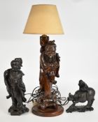 Three Chinese carved figures including boy on a buffalo, tallest 47cm