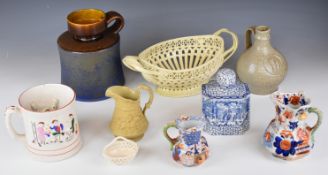 Pottery items including a German bellarmine jug, West German ewer, Leeds creamware basket, Masons