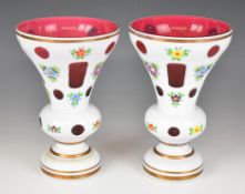 A pair of overlaid and cut glass vases, height 22cm