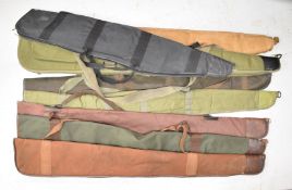 Eight padded shotgun or rifle slips including an Alboro Hunting faux leather example.