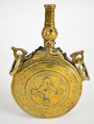Ottoman brass powder flask with engraved decoration and brass suspension loops, 18cm long.