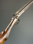 Belgian .410 side by side hammer action shotgun with round body, chequered semi-pistol grip and