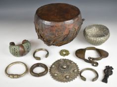 African tribal items including a Yoruba Iku or dance rattle, hide drum, metal lattice and filigree