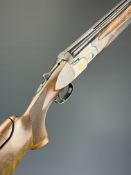 Beretta ASE Gold Trap 12 bore over and under ejector shotgun with gold inlaid naming, chequered