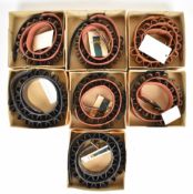Seven Brady shotgun cartridge belts comprising four 12 bore, one 16 bore, one 20 bore and one 28