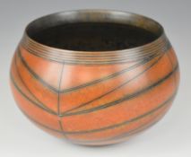 Duncan Ross (b1943) studio pottery bowl with burnished orange glaze and geometric decoration,