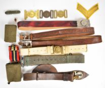 Five belts including many military issues, together with many belt buckles including