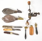 A collection of gun and sporting related items comprising a copper and brass powder flask, two