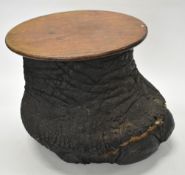 19thC taxidermy elephant foot coffee table with circular mahogany top, diameter 41 x H36cm