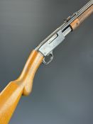 Browning .22 pump-action rifle with semi-pistol grip, adjustable sights and 22 inch barrel,
