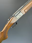 Baikal NX-27E-IC 12 bore over and under ejector shotgun with silver inlaid action featuring engraved