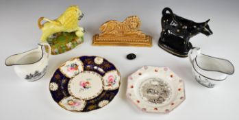 Staffordshire lion figure, flatback, cow creamer and two 19thC bat printed jugs etc., tallest 15cm