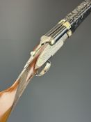 Silver Sabel De Luxe 12 bore sidelock side by side ejector shotgun with rose and scroll engraving to