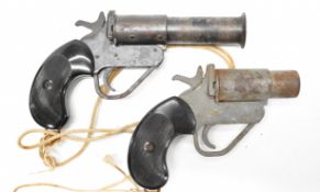 Two 1 inch bore flare or signalling Very pistols, each with reeded composite grips and belt loop,