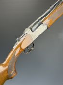Sportsmarketing 12 bore over and under shotgun with engraved locks, underside, trigger guard, top
