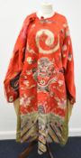 19th/20th Chinese red silk robe embroidered with a four clawed dragon, W168 x L135cm