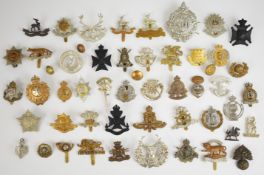 Fifty two cap badges, buttons and insignia to include Royal Warwickshire, 1st Birmingham