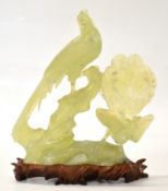 Chinese carved jadeite or similar bird group, on stand, H20cm
