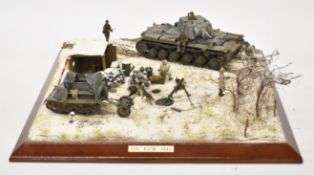 1/35 scale model diorama of a Soviet KV-1B tank and T-20 tank with Infantry moving through a snowy
