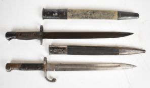 Two bayonets comprising a Brazilian M1918 bayonet with 29.5cm blade, crossguard with quillon