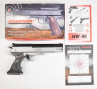 Weihrauch HW45 SIlver Star .22 air pistol with textured laminate show wood grips and adjustable