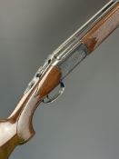Lanber 20 bore over and under shotgun with engraved scenes of birds to the action and underside,