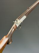 Unnamed.410 hammer action shotgun converted from a .320 rook rifle, with chequered semi-pistol