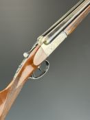 Gunmark Kestrel 20 bore side by side ejector shotgun with engraved scenes of birds to the locks