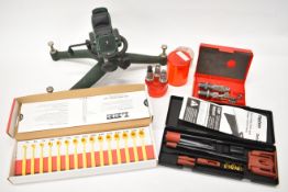 A collection of gun and re-loading items including Caldwell Rock BR stand and clamp, Lee powder