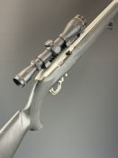 Ruger Model 10/22 .22 semi-automatic rifle with composite stock, textured semi-pistol grip, seven
