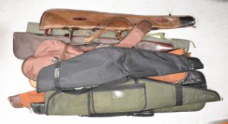 Ten various shotgun or rifle slips including Beretta, padded and leather examples etc.