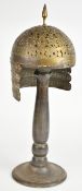 Indian /Persian brass helmet with spike finial, on stand, H25cm