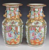 Pair of 19thC Chinese famille rose twin handled vases with figural decoration of court scenes,