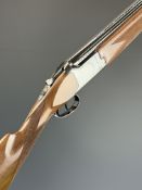 Miroku 12 bore over and under ejector shotgun with border engraved action, named underside,
