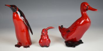 Royal Doulton flambé lop eared rabbit, penguin and duck, tallest 15cm