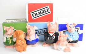 Set of five Wade Nat West pig money boxes, in original packaging and with Nat West paperwork/folder