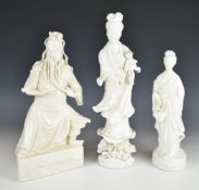 Three Chinese blanc de chine figures of Guanyin and Guan Yu, tallest 34cm