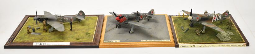 Three WW2 model dioramas comprising a 1/43 scale Soviet Soviet YAK 9T on the ground having