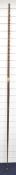 A hardwood longbow of unknown origin, of triangular cross section form and concave belly / face,