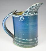Walter Keeler (b1942) studio pottery jug with mottled blue glaze, H16.5cm Provenance: From the