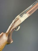 Beretta 694 Trap 12 bore over and under ejector shotgun with named action and underside, chequered