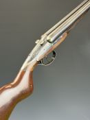 Darne 12 bore side by side shotgun with sliding action, named top lever, semi-pistol grip, chequered